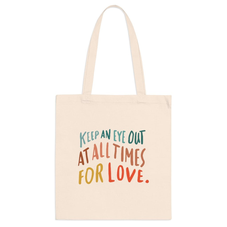Trendy natural cloth errand bag printed on the front with hand-lettered colorful quote about love.