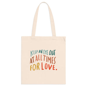 Trendy natural cloth errand bag printed on the front with hand-lettered colorful quote about love.