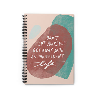 Motivating quote about living your best life hand-lettered and illustrated with abstract shapes on a spiral A5 notebook. 