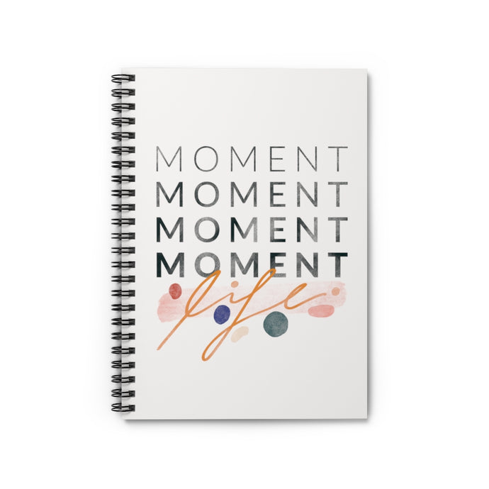 Inspiring statement about cherishing the little moments, with cute abstract shapes, printed on the cover of a spiral notebook. 