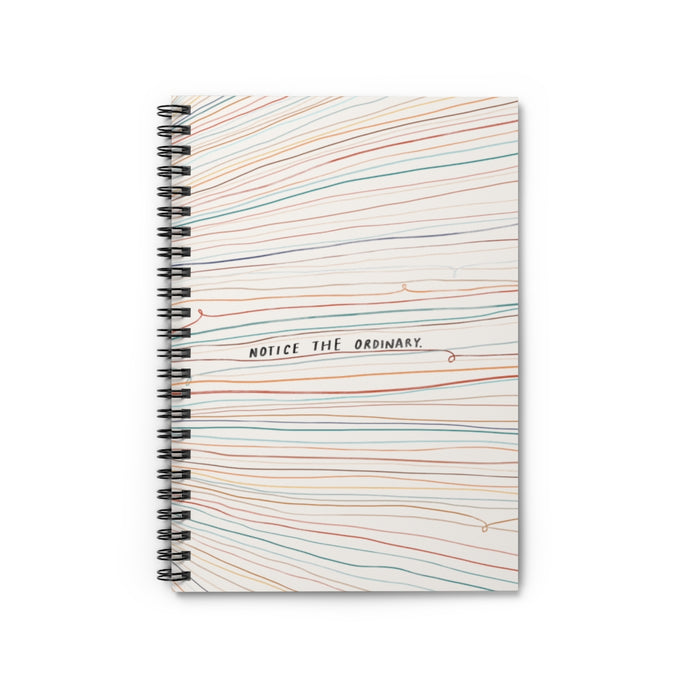 6” x 8” spiral notebook with hand-drawn colorful lines and a quote that reads “Notice the ordinary” on the cover.